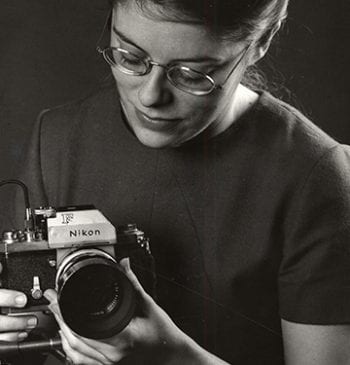Virginia Geren, photographer for UM Photo Services, holding camera