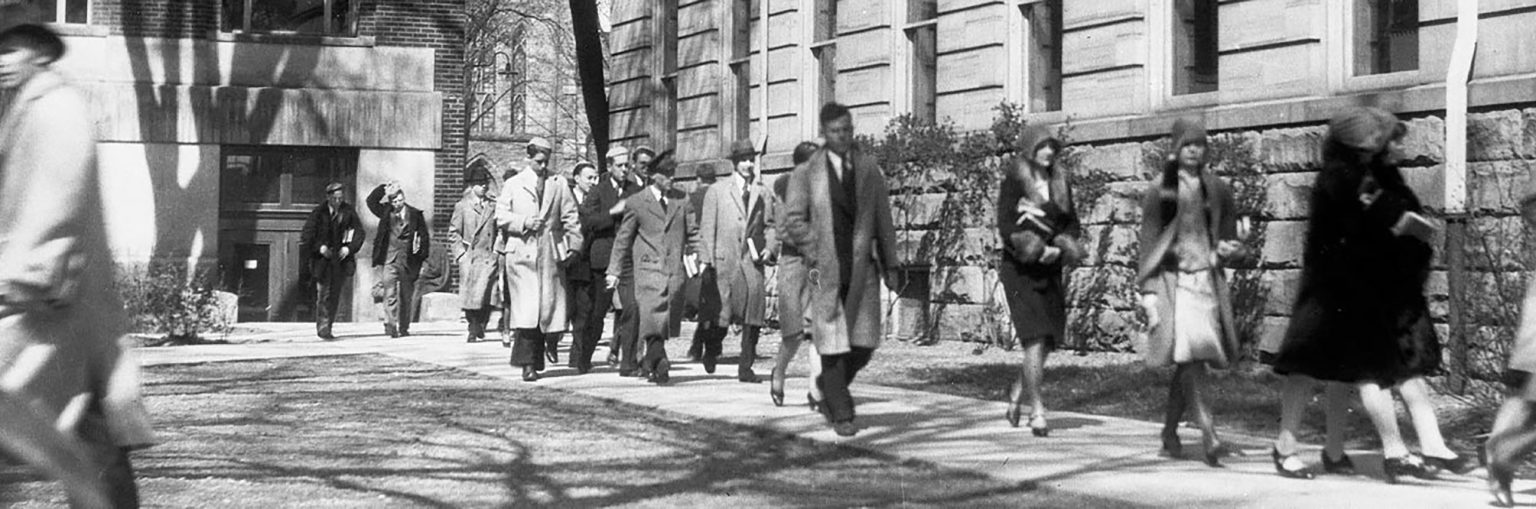 A photo of students walking on campus, circa 1929.