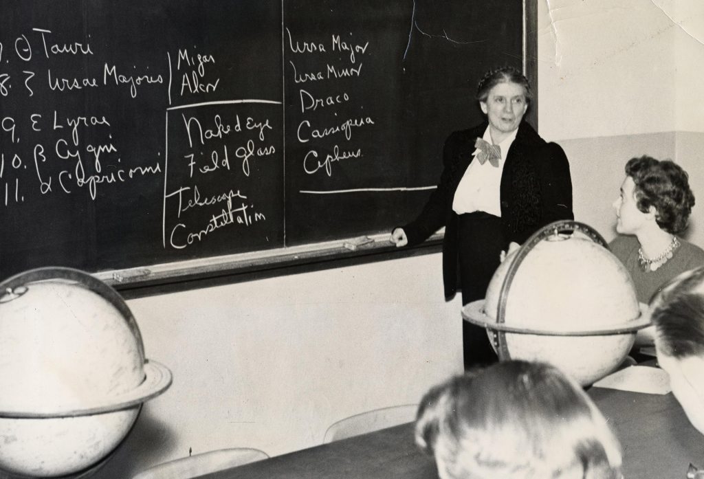 A photo of Hazel Losh teaching an astronomy class around 1950.